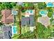 Aerial view of a private backyard pool and spa in lush green backyard at 991 Hawthorne Cove Ct, Ocoee, FL 34761