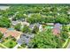 An aerial neighborhood view shows the property, mature trees, and nearby houses at 991 Hawthorne Cove Ct, Ocoee, FL 34761