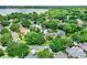 Stunning aerial view of a lakeside community with lush landscaping and beautiful homes at 991 Hawthorne Cove Ct, Ocoee, FL 34761