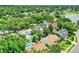 A high altitude aerial view with a pin marker on the subject property at 991 Hawthorne Cove Ct, Ocoee, FL 34761