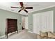 Bedroom with traditional chest of drawers, carpet floors, ceiling fan, and closet at 991 Hawthorne Cove Ct, Ocoee, FL 34761