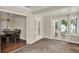 Formal dining room adjacent to a Florida room, with French doors to backyard, features brick floors at 991 Hawthorne Cove Ct, Ocoee, FL 34761