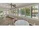 Florida room with views of the pool from windows with plantation shutters, and a ceiling fan at 991 Hawthorne Cove Ct, Ocoee, FL 34761