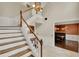 Entryway with staircase, decorative fixtures, and doorways leading to various rooms, blending classic charm at 991 Hawthorne Cove Ct, Ocoee, FL 34761