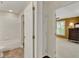 Hallway with bathroom and bedroom entrances, showing tile and carpet flooring at 991 Hawthorne Cove Ct, Ocoee, FL 34761