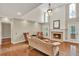 This spacious living room has high ceilings, a fireplace, and a view of the backyard at 991 Hawthorne Cove Ct, Ocoee, FL 34761