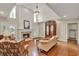 Open concept living room features a fireplace, a large mirror, and wood floors at 991 Hawthorne Cove Ct, Ocoee, FL 34761