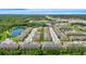 Scenic aerial view of the community with a pond, lush greenery, and convenient access to the highway at 10070 Red Eagle Dr, Orlando, FL 32825