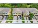 Aerial view of townhomes showcasing rooftops, driveways, and landscaping at 10070 Red Eagle Dr, Orlando, FL 32825