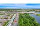 Aerial view of townhome community near green spaces and roadways at 10070 Red Eagle Dr, Orlando, FL 32825