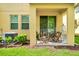 Outdoor patio area with comfortable seating and a view of the well-manicured backyard at 10070 Red Eagle Dr, Orlando, FL 32825