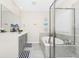 Spacious bathroom featuring double vanity sinks, a soaking tub, and a glass-enclosed shower at 10070 Red Eagle Dr, Orlando, FL 32825