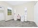 Bedroom with ceiling fan, mirror, shelving, white desk and pink chair at 10070 Red Eagle Dr, Orlando, FL 32825