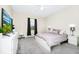 Serene bedroom with plush carpet, neutral tones, and a comfortable bed with decorative pillows at 10070 Red Eagle Dr, Orlando, FL 32825