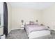 Bright bedroom features a modern bed frame, soft carpet, and two side tables with lamps at 10070 Red Eagle Dr, Orlando, FL 32825