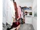 A functional closet with ample hanging space, shelving, and storage drawers for organized storage at 10070 Red Eagle Dr, Orlando, FL 32825