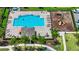 Aerial view of community pool, playground, seating, and landscaping at 10070 Red Eagle Dr, Orlando, FL 32825