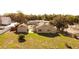 Aerial view of the single story home with large yard and accessory building at 1020 E Main St, Haines City, FL 33844