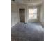 Spacious bedroom featuring a large window and a walk-in closet space at 1020 E Main St, Haines City, FL 33844