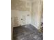A laundry room featuring wood-look flooring and connection points for a washer and dryer at 1020 E Main St, Haines City, FL 33844