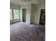 Living room featuring a large closet and unfinished wood floors, ready for renovation at 1020 E Main St, Haines City, FL 33844