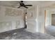 Living room with ceiling fan, fireplace with niche, and multiple entries at 1020 E Main St, Haines City, FL 33844