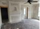 Spacious living room featuring an arched fireplace and multiple doorways at 1020 E Main St, Haines City, FL 33844