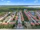 Aerial community view featuring a long street, green trees, and multiple lakes at 1434 Pacific Rd, Kissimmee, FL 34759