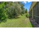 Lush backyard with mature trees and green grass at 1434 Pacific Rd, Kissimmee, FL 34759