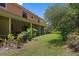 Backyard with an AC unit and a partial view of a screened in porch at 1434 Pacific Rd, Kissimmee, FL 34759