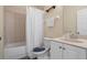 Bathroom featuring a shower-tub, white tile and single sink vanity at 1434 Pacific Rd, Kissimmee, FL 34759