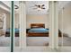 Bedroom featuring sliding mirror closet door, carpeted floors, and a ceiling fan at 1434 Pacific Rd, Kissimmee, FL 34759