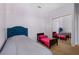 Bedroom with two beds and a sliding closet door with carpeted floors at 1434 Pacific Rd, Kissimmee, FL 34759