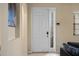 Interior shot of the front door with glass panels, light walls, and a glimpse of the living space at 1434 Pacific Rd, Kissimmee, FL 34759