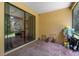 Relaxing screened-in patio with brick flooring and sliding glass doors to the interior at 1434 Pacific Rd, Kissimmee, FL 34759