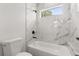 Bathroom with tub and large, modern tile surround at 14905 Sw 39Th Cir, Ocala, FL 34473
