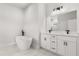 Bright bathroom featuring a standalone tub and double vanity with modern fixtures at 14905 Sw 39Th Cir, Ocala, FL 34473
