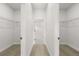 Walk-in closet featuring built in shelving and light wood flooring at 14905 Sw 39Th Cir, Ocala, FL 34473