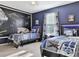 Themed bedroom designed with Star Wars decor, featuring two twin beds and creative accents at 1606 Lima Ave, Kissimmee, FL 34747