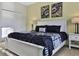 Bedroom with a king bed, neutral walls and carpet, and a closet with sliding doors at 1606 Lima Ave, Kissimmee, FL 34747