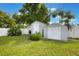 Backyard featuring two storage sheds for storing equipment, tools, and outdoor items, enhancing organization at 1615 W Gadsen Blvd, Orlando, FL 32812