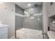 Nicely tiled bath and shower featuring a sliding glass door, gray tiles, and a vessel sink at 1615 W Gadsen Blvd, Orlando, FL 32812
