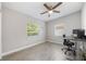 This bedroom has lots of natural light, gray floors and neutral walls that make it very inviting at 1615 W Gadsen Blvd, Orlando, FL 32812
