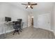 This bedroom provides a calming atmosphere with modern floors and neutral decor with dual closets at 1615 W Gadsen Blvd, Orlando, FL 32812