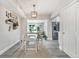 The light-filled dining area features a modern chandelier and easy access to kitchen at 1615 W Gadsen Blvd, Orlando, FL 32812