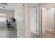 View of hallway showcasing the updated gray floors and access to the bathroom and bedroom at 1615 W Gadsen Blvd, Orlando, FL 32812