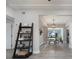 Hallway view leading into the dining room, featuring luxury vinyl plank flooring at 1615 W Gadsen Blvd, Orlando, FL 32812
