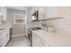Updated kitchen featuring quartz countertops, subway tile backsplash, and stainless steel appliances at 1615 W Gadsen Blvd, Orlando, FL 32812