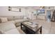 Comfortable living room with a large sectional couch and decorative coffee table at 1615 W Gadsen Blvd, Orlando, FL 32812