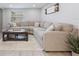 Bright living room featuring a sectional couch and neutral color palette at 1615 W Gadsen Blvd, Orlando, FL 32812